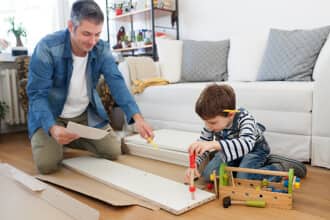 Father building furniture with son