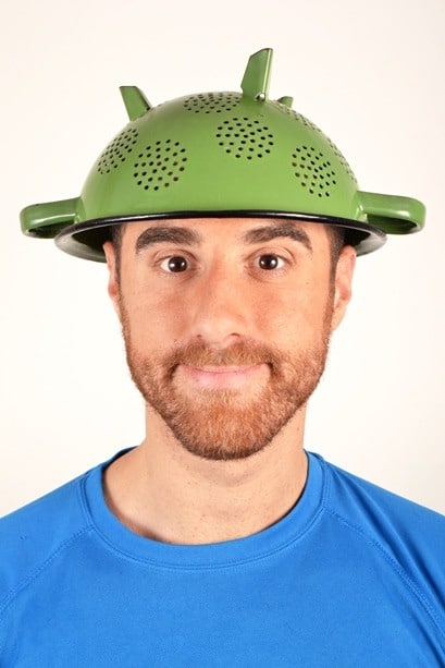 Man wearing colander on his head